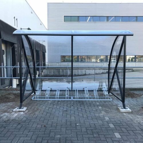 Fietsoverkapping BF1000 - AANBIEDING 63 Afgebeeld de 3 meter uitvoering van deze fraaie overdekte fietsenstalling - rijwieloverkapping BF1000, voorzien van onze hoog-laag fietsenrekken, model 1000